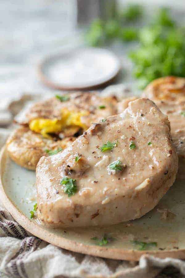 Cooked pork chops served on a plate