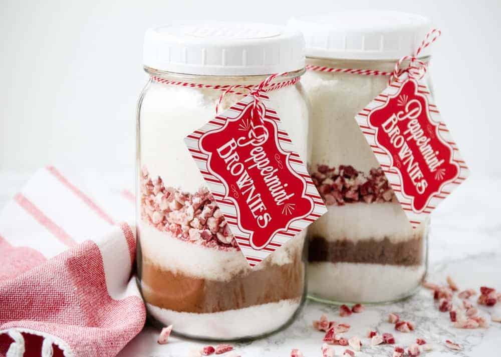 Peppermint Brownies in a Jar next to a red and white tablecloth