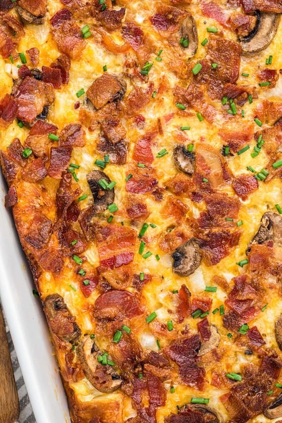 Savory bacon breakfast casserole baked with bread, eggs, and melted cheese — a hearty make-ahead holiday breakfast.