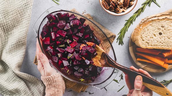 Roasted beets glazed with balsamic and rosemary, served on a holiday platter — festive Christmas vegetable side.