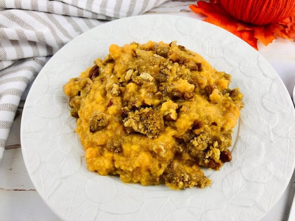 Southern-style sweet potato casserole with marshmallows toasted golden brown — classic holiday side dish.