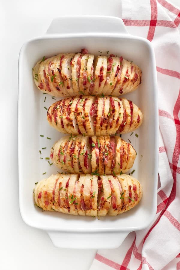 Golden roasted Hasselback turnips sliced thin — low-carb Christmas side dish for a modern holiday table.