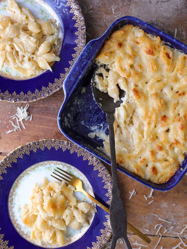 Creamy white cheddar mac and cheese in a skillet — elegant Christmas side dish recipe with gourmet flavor.