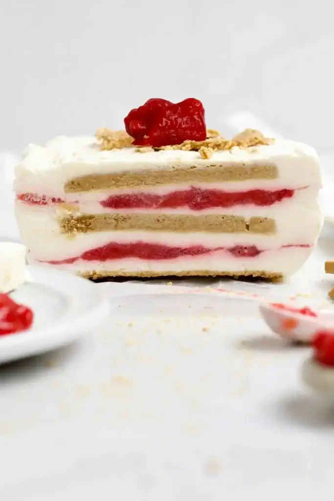 Strawberry cream cheese icebox cake with layered filling and fresh strawberries on top